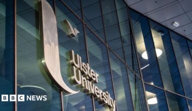 A glass building with a sign reading Ulster University