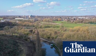 Woman and child die after getting into ‘difficulty’ in water in west London | UK news