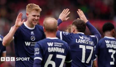 Josh Coburn (right) hits his shot past a despairing Luke Ayling as another Middlesbrough player in Alan Browne watches on