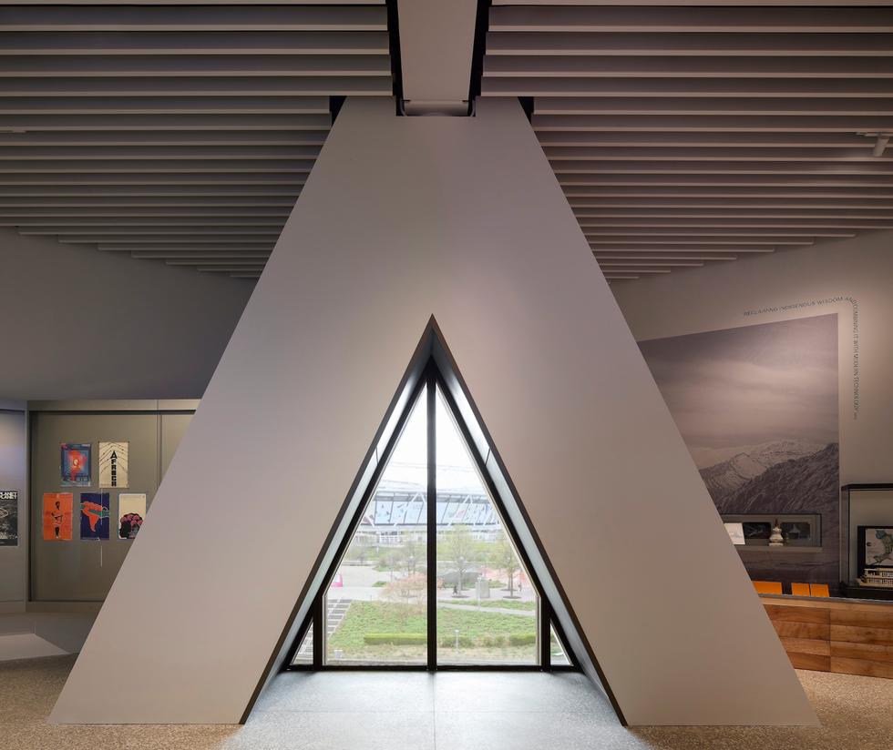 Geometric architectural structure featuring a large triangular window.