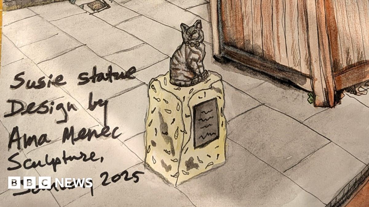An ink and pen sketch of the cat statue. The tabby cat is sitting on a low stone plinth on the pavement next to a wooden planter. A handwritten note reads: Susie statue design by Ama Menec Sculpture, January 2025.