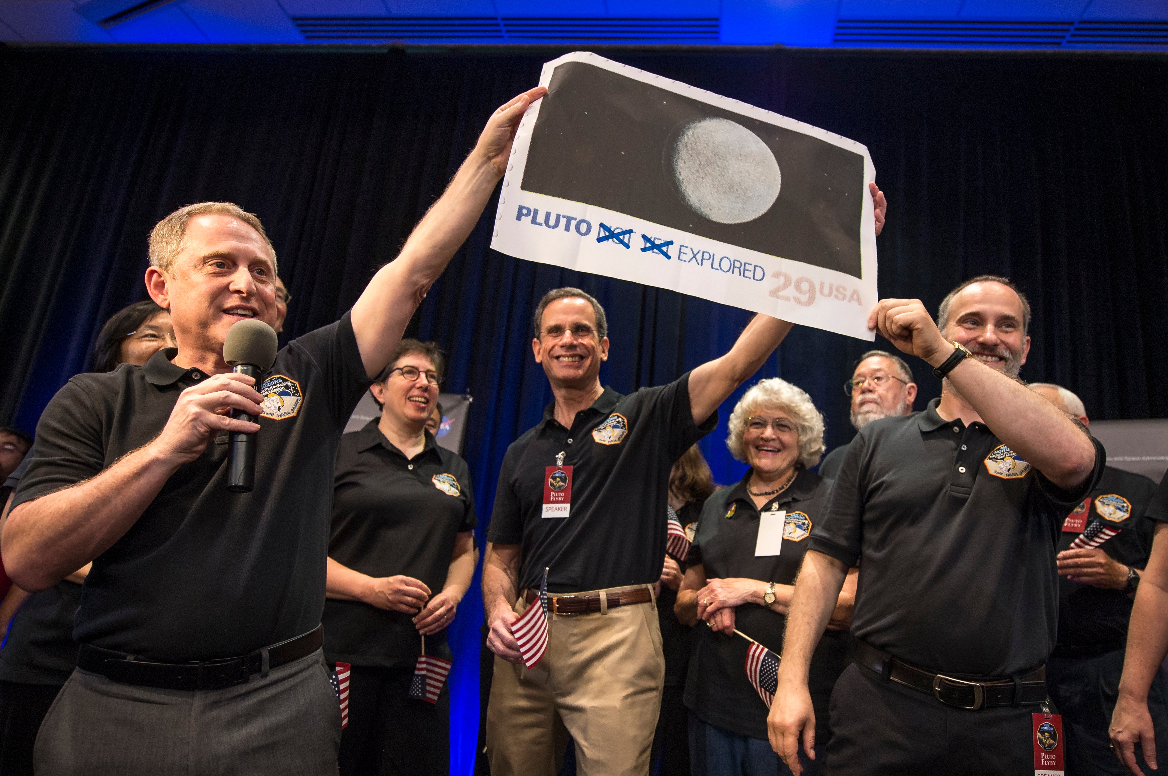 NASA scientists sent an unmanned spacecraft to fly by Pluto in 2015, capturing images of its icy mountains
