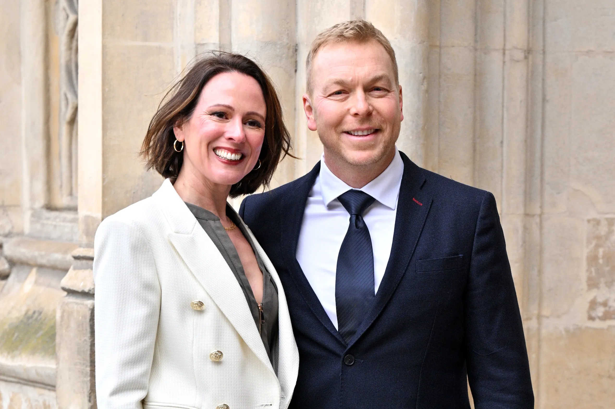 Sarra Kemp in a white blazer and Sir Chris Hoy in a dark suit and kilt attend Commonwealth Day celebrations.