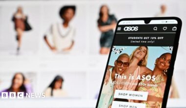 An illustration with a laptop and mobile phone shows the website of online fashion retailer ASOS on August 12, 2021.