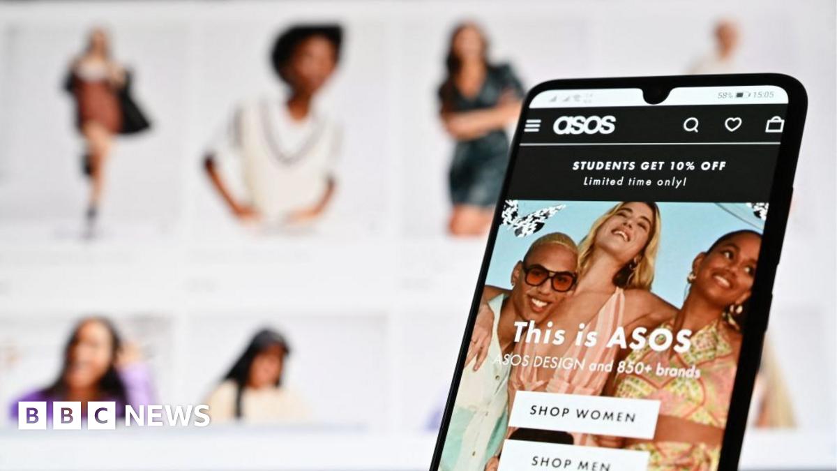 An illustration with a laptop and mobile phone shows the website of online fashion retailer ASOS on August 12, 2021.