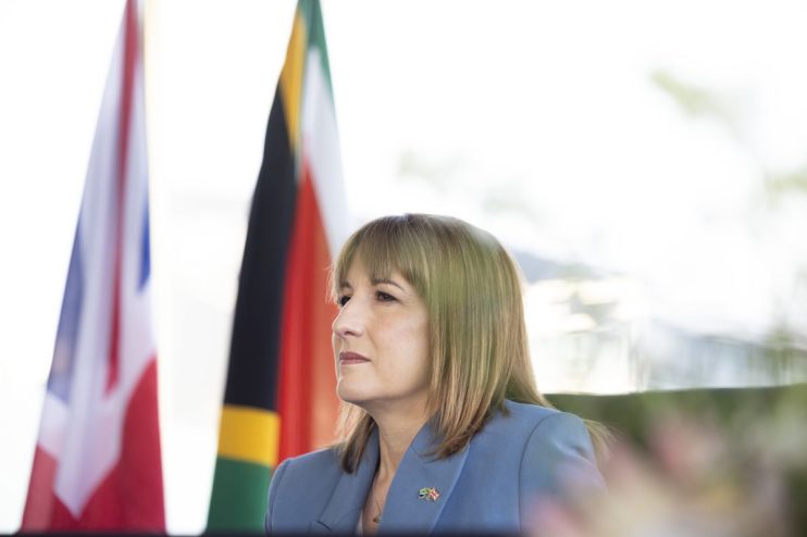 Breaking news update on recent developments in global business trends, featuring a bustling corporate office environment