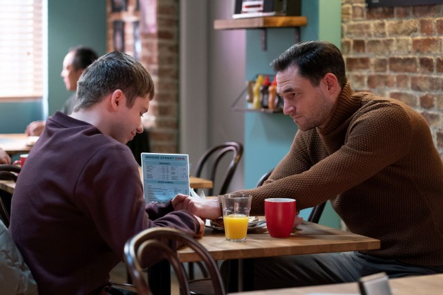 Barney and Zack in the cafe in EastEnders