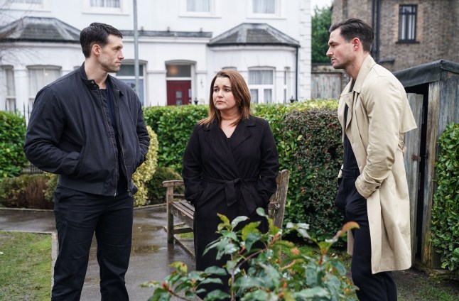 Mark and Vicki Fowler and Zack Hudson stood on Albert Square in EastEnders