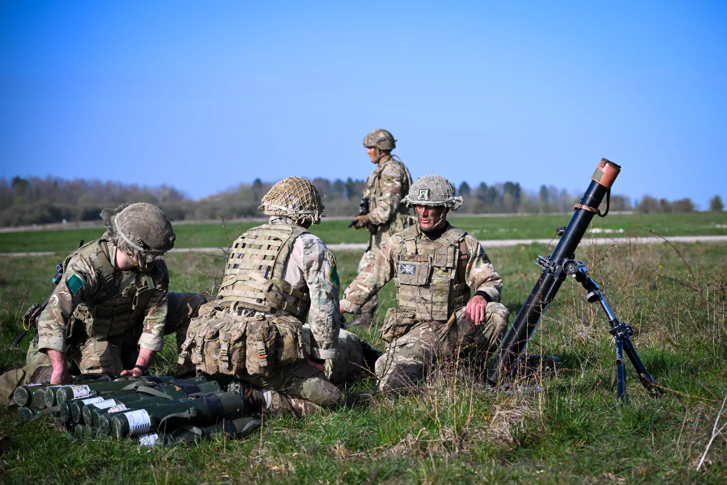 Soldiers setting up a mortar firing position after parachuting onto Salisbury Plain.