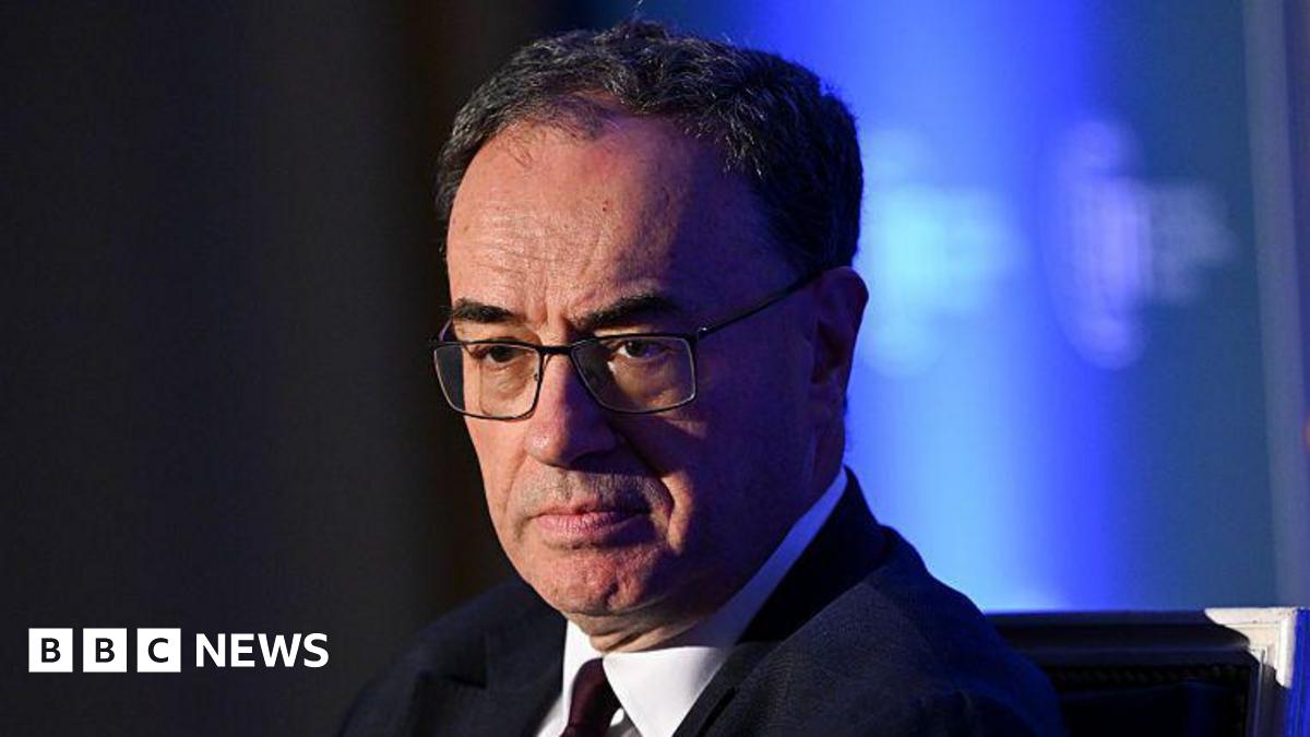 Andrew Bailey head and shoulders wearing a suit and tie with his eyes cast downwards and a serious expression on his face