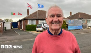 A St George's flag on display near the top of a lamppost on Leeds Road, Outwood, Wakefield.