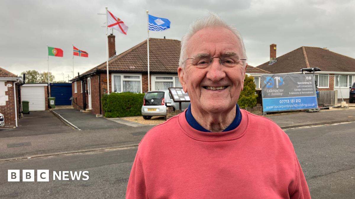 A St George's flag on display near the top of a lamppost on Leeds Road, Outwood, Wakefield.
