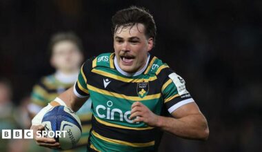 George Furbank running with his tongue out on the way to score for Northampton Saints.