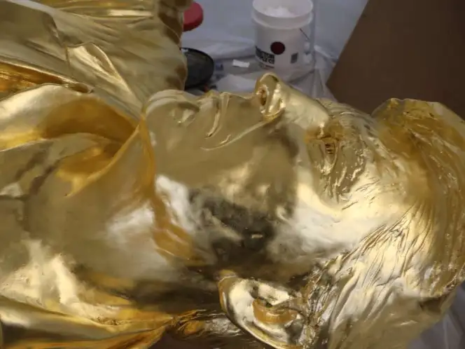 Close-up of Alan Cottrill's golden statue of President Trump.