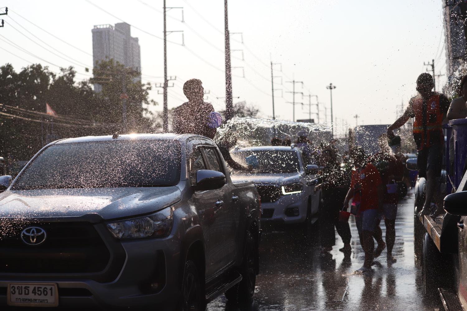 Revellers enjoy the final throes of Songkran in Samut Prakan, as attention turns to the economic outlook after the holiday. Somchai Poomlard