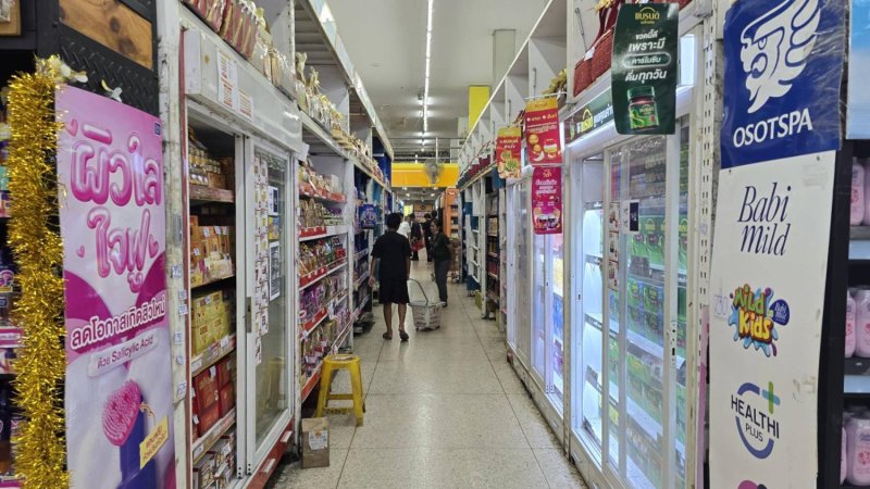 Shoppers browse goods on display at a supermarket in Udon Thani.