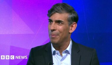 Former Prime Minister Rishi Sunak wears a dark suit jacket and light blue shirt