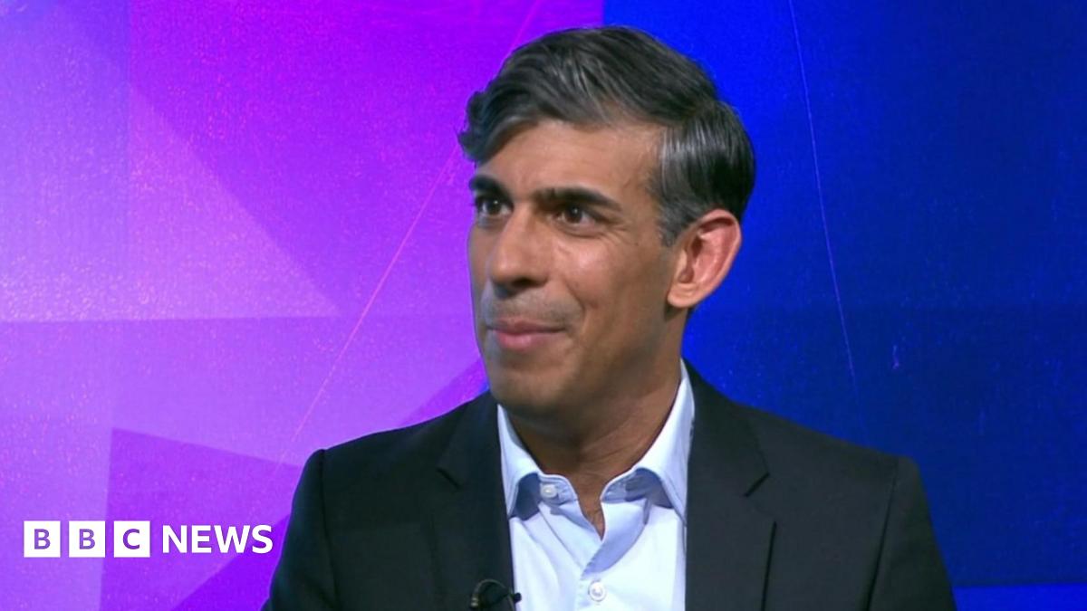 Former Prime Minister Rishi Sunak wears a dark suit jacket and light blue shirt