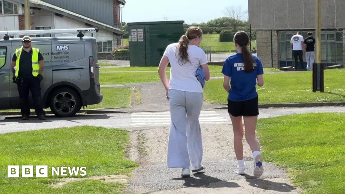 Queue of students heading in to get the antibiotics at a school in Weymouth.