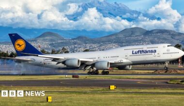 Parked Lufthansa aircraft are lined up at Frankfurt Airport on April 13, 2026.