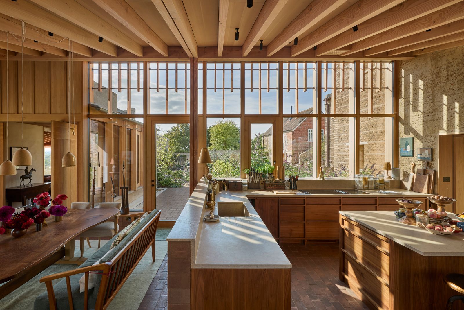 Image may contain Indoors Interior Design Wood Hardwood Stained Wood Kitchen Window and Floor