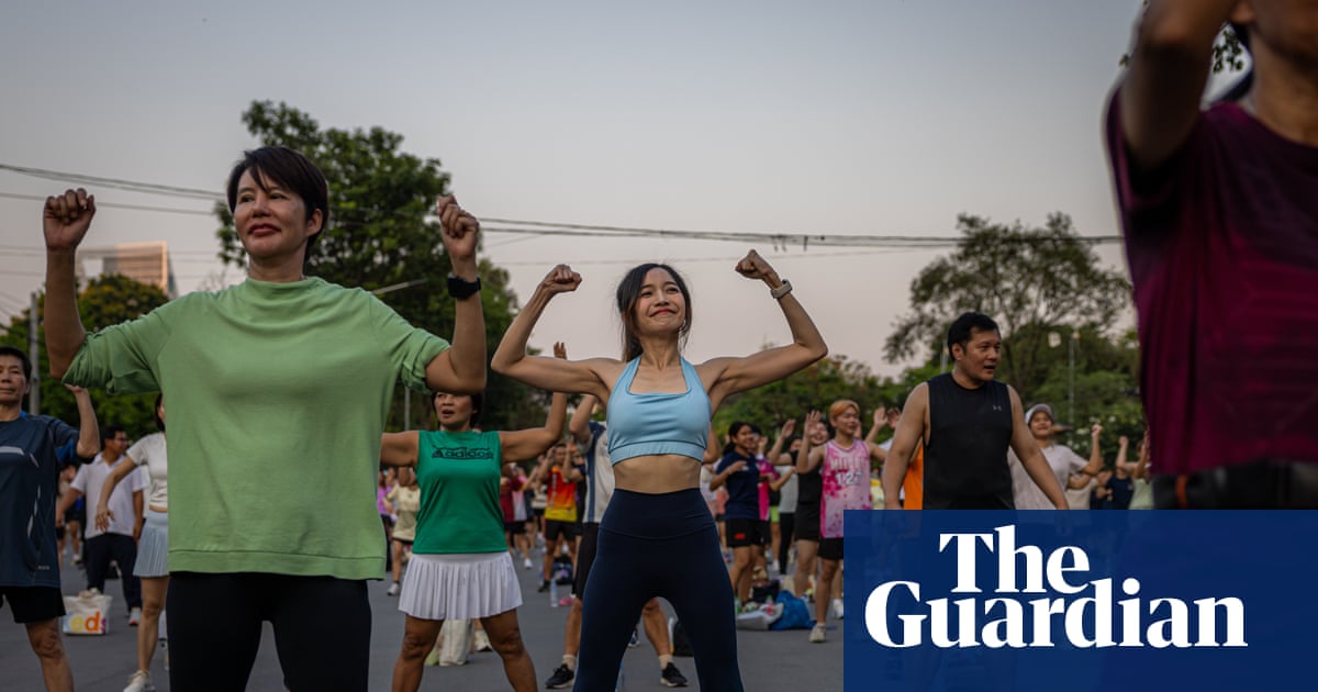 ‘There’s more to life than work’: Bangkok’s young people embrace mass outdoor aerobics sessions | Thailand