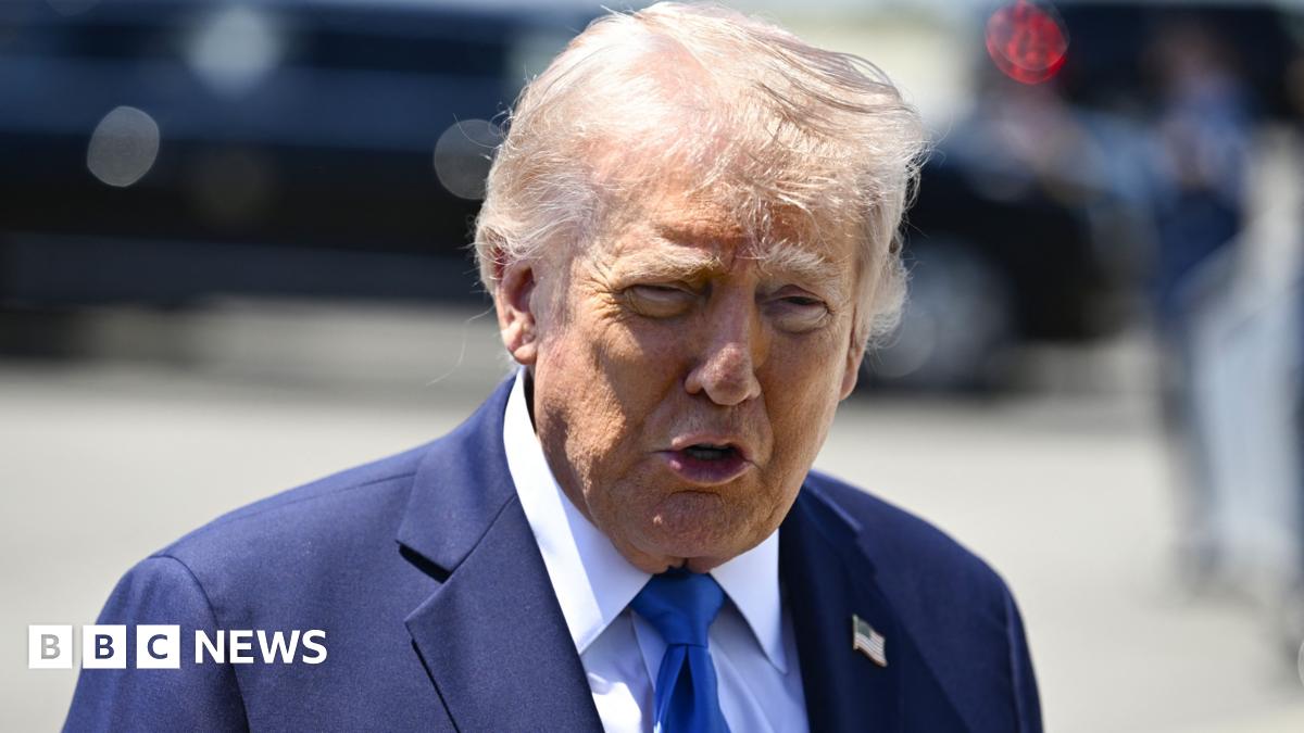 US President Donald Trump speaks to reporters before boarding Air Force One in Palm Beach, Florida.