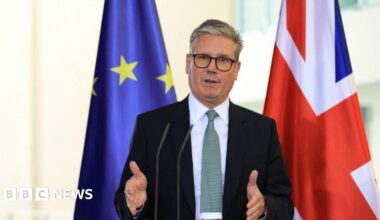Keir Starmer, UK prime minister, during a news conference standing in front of the EU and Union Jack flags.