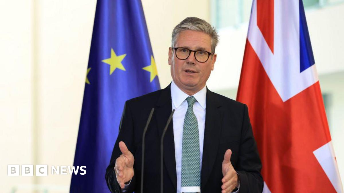 Keir Starmer, UK prime minister, during a news conference standing in front of the EU and Union Jack flags.