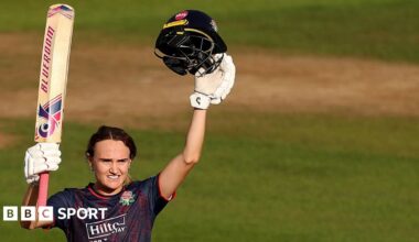 Gaby Lewis of Lancashire celebrates reaching her century