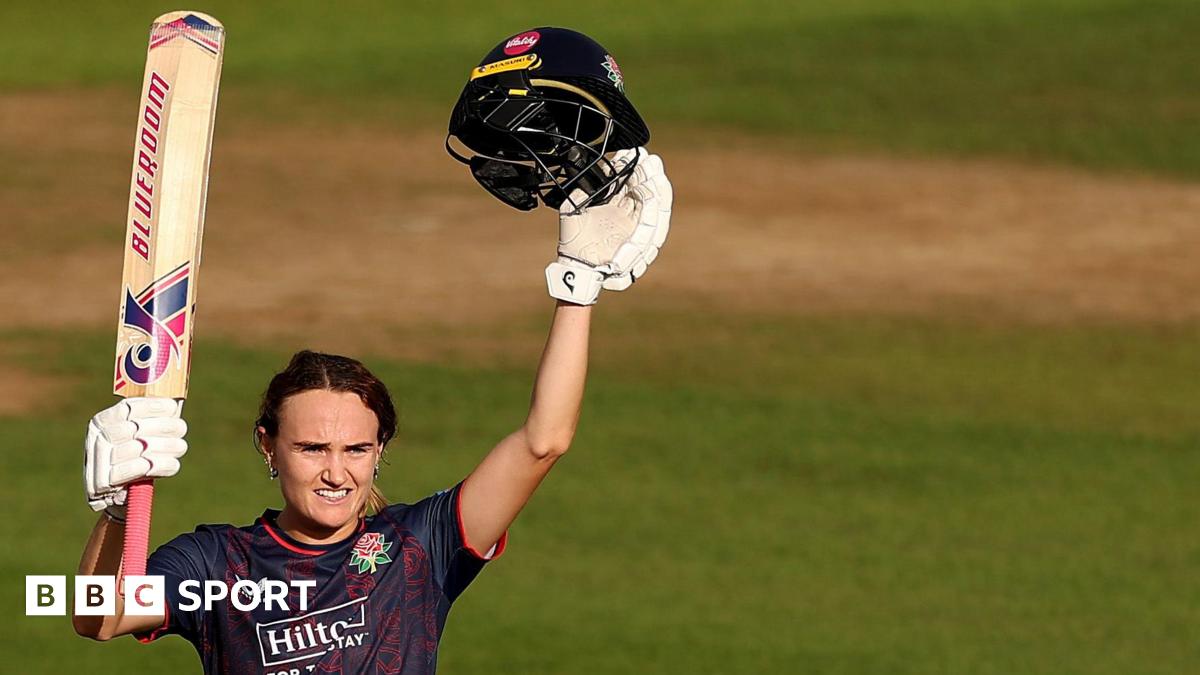 Gaby Lewis of Lancashire celebrates reaching her century