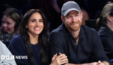 Meghan, Duchess of Sussex and Prince Harry, Duke of Sussex sit courtside at a basketball game in California