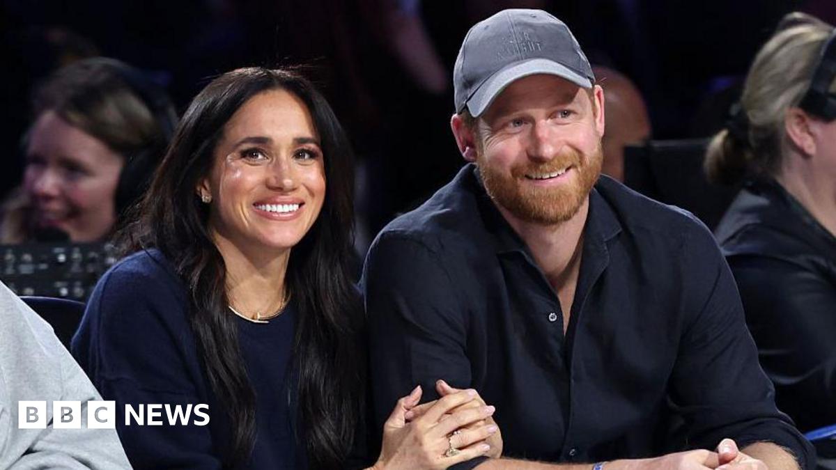 Meghan, Duchess of Sussex and Prince Harry, Duke of Sussex sit courtside at a basketball game in California