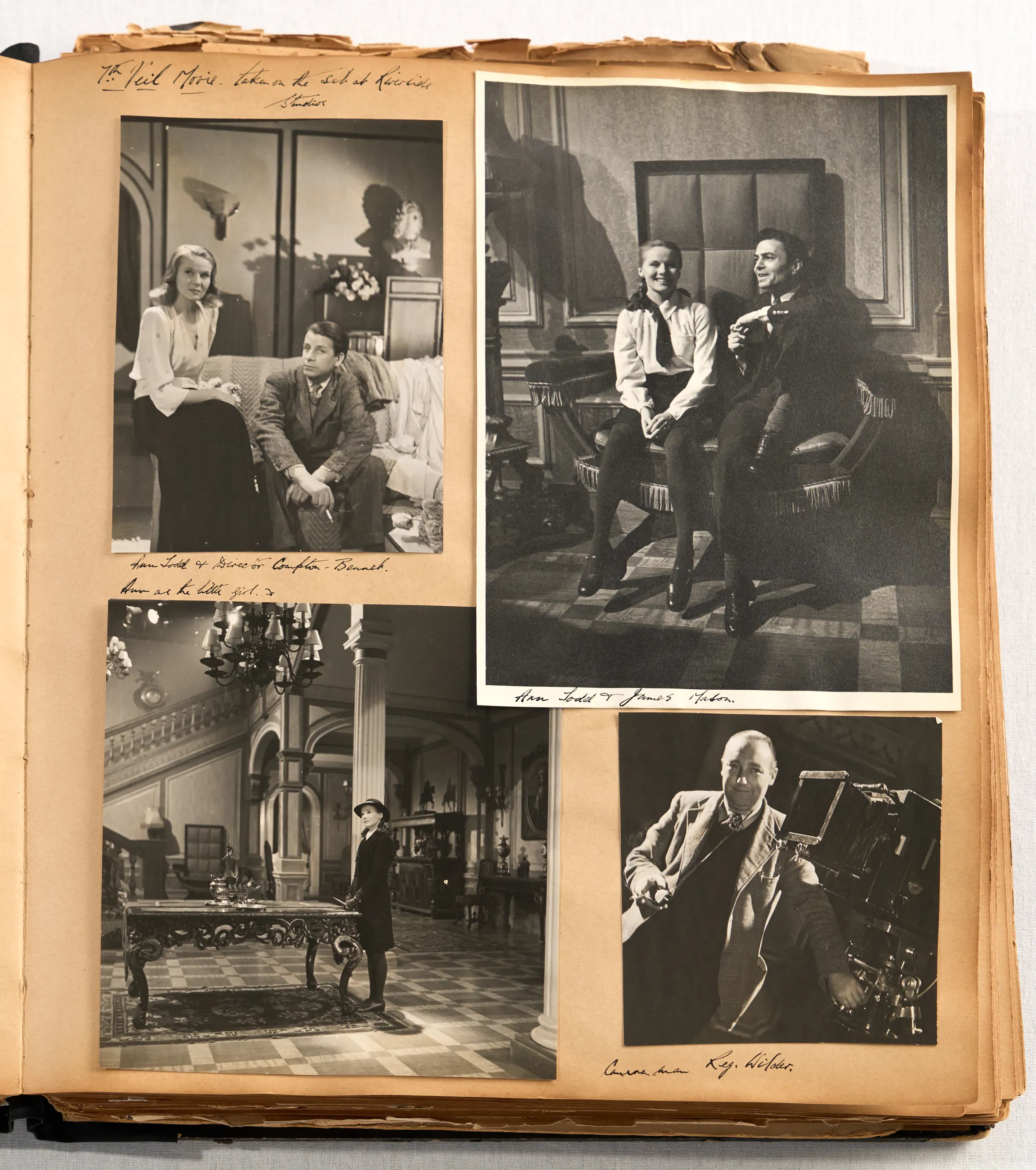 The Miller-Beaton scrapbook, a photo album open to two pages displaying various black and white photographs from the 1940s.