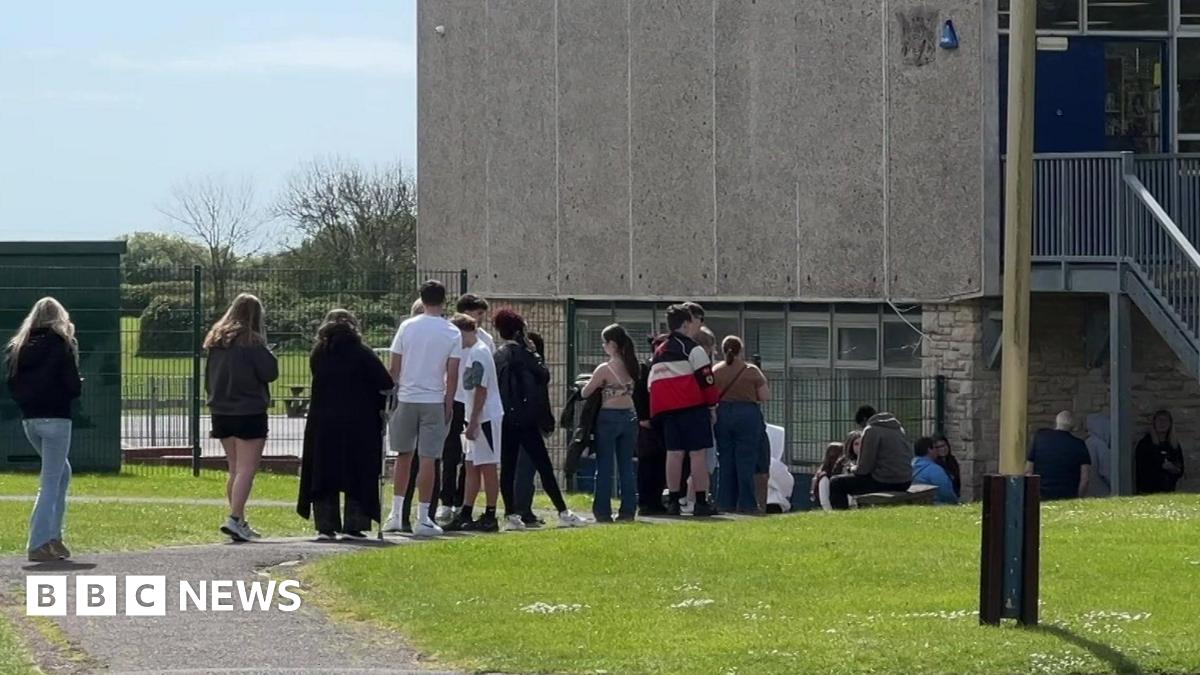 Queue of students heading in to get the antibiotics and jab at a school in Weymouth.