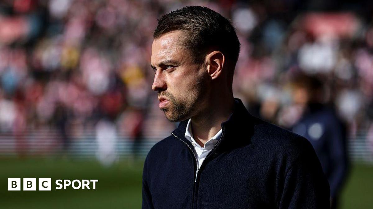 Tonda Eckert looks on from the sidelines