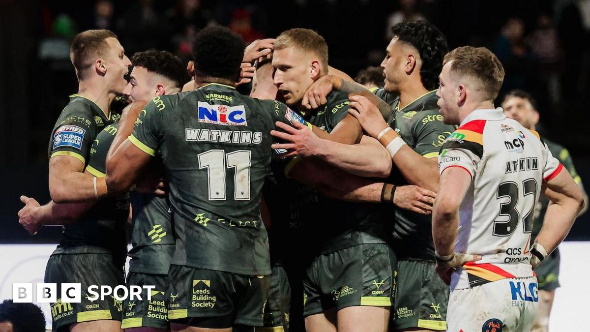 James McDonnell of Leeds celebrates with team-mates after scoring a try