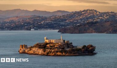 A stock image of Alcatraz prison, showing a building sitting on an island