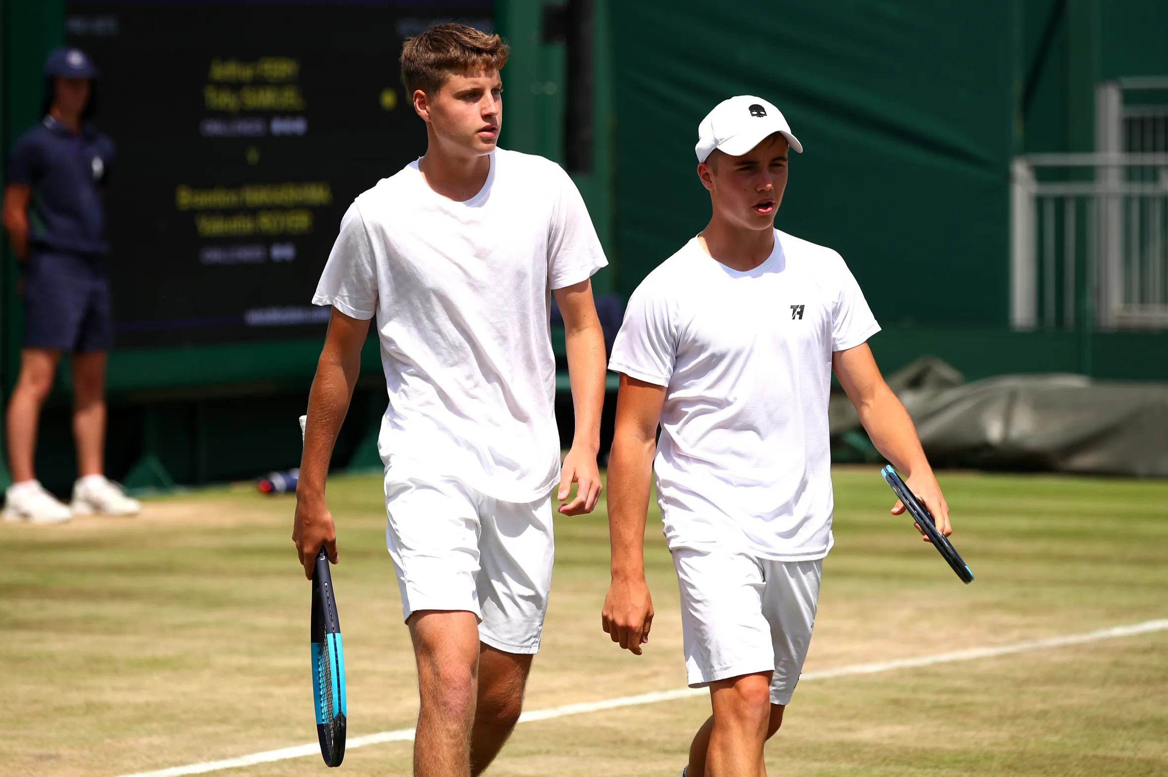 Arthur Fery and Toby Samuel on the court during a Wimbledon 2019 match.