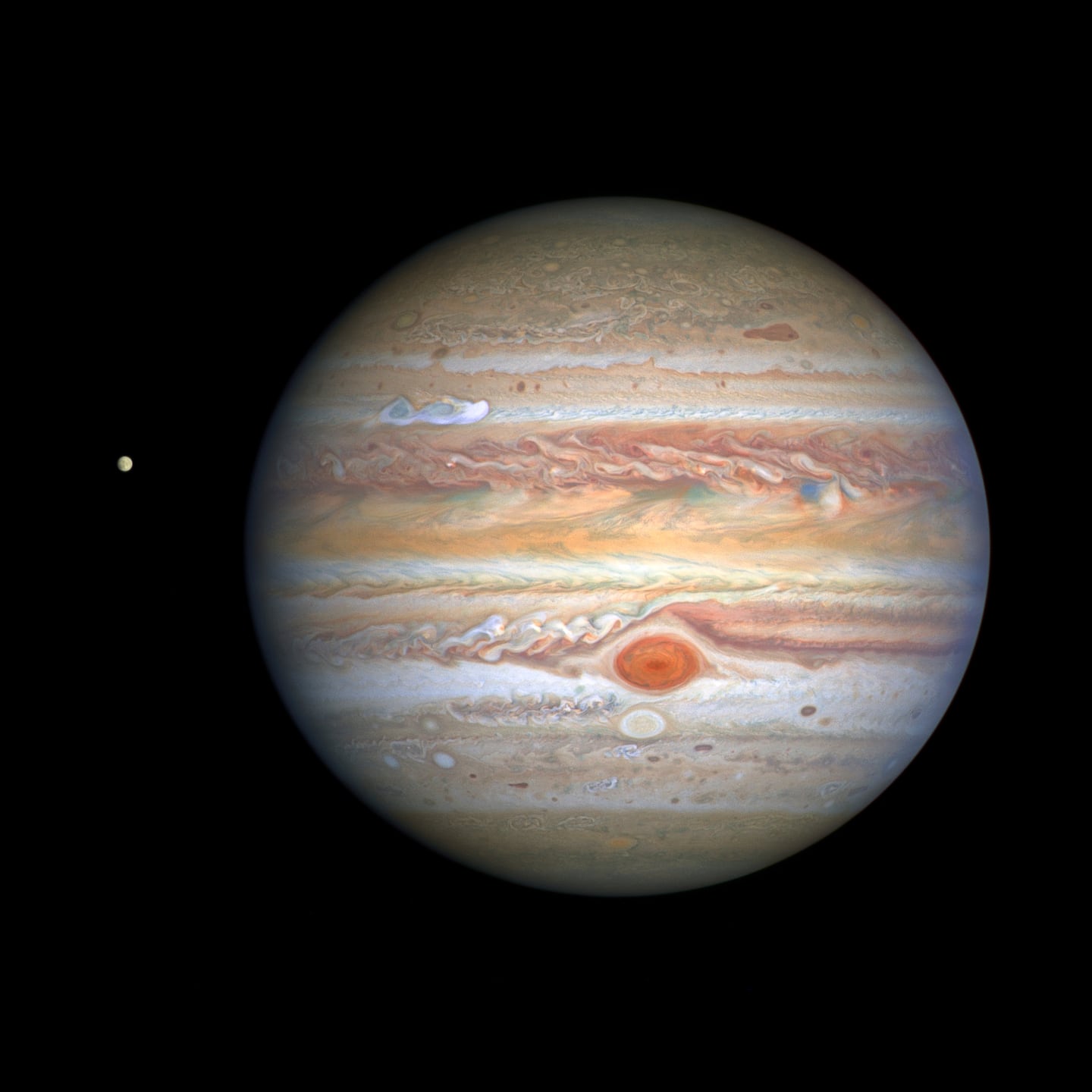 This Aug 25, 2020 image captured by NASA's Hubble Space Telescope shows the planet Jupiter and one of its moons, Europa, at left, when the planet was 406 million miles from Earth. 