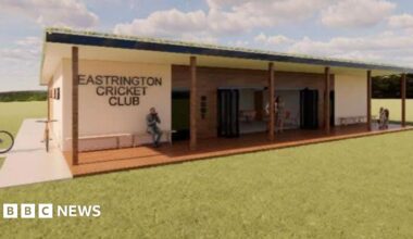 An artist's impression of a modern wood-clad pavilion building with the name of the club on the front. The front area has a canopy and seating area.