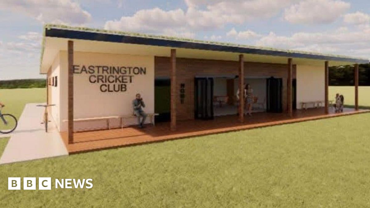An artist's impression of a modern wood-clad pavilion building with the name of the club on the front. The front area has a canopy and seating area.