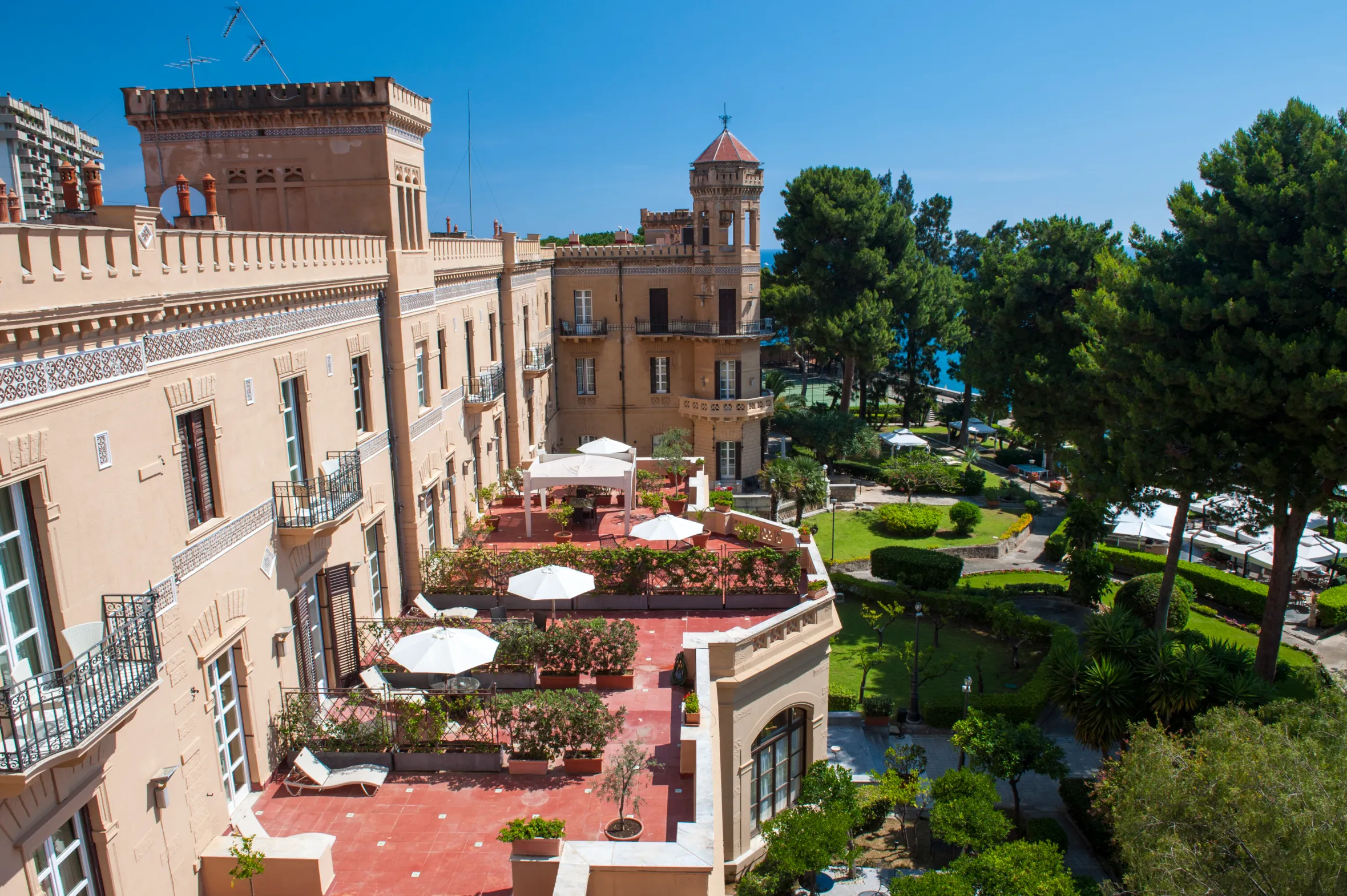 View of Villa Igiea, a hotel in Sicilian Art Nouveau style, overlooking the ocean.