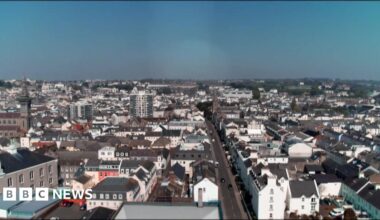 A drone shot of a number of buildings and homes in Jersey.