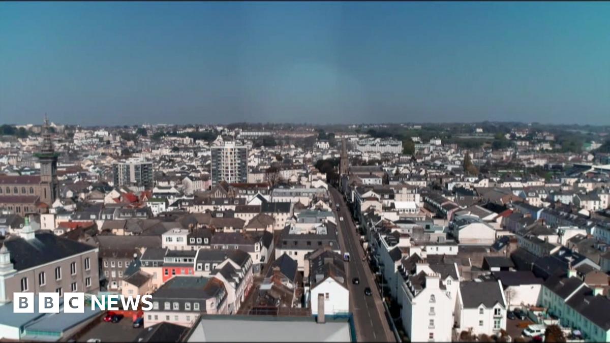 A drone shot of a number of buildings and homes in Jersey.