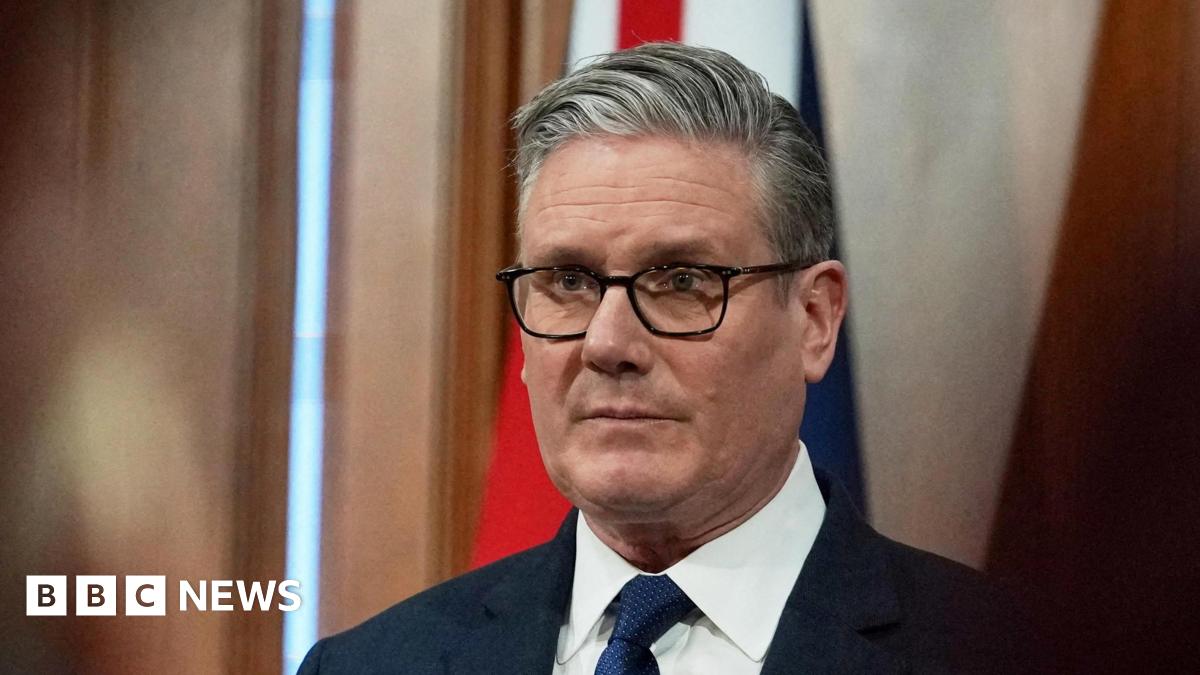 Sir Keir Starmer looking reflective, as he prepares to address a Downing Street news conference
