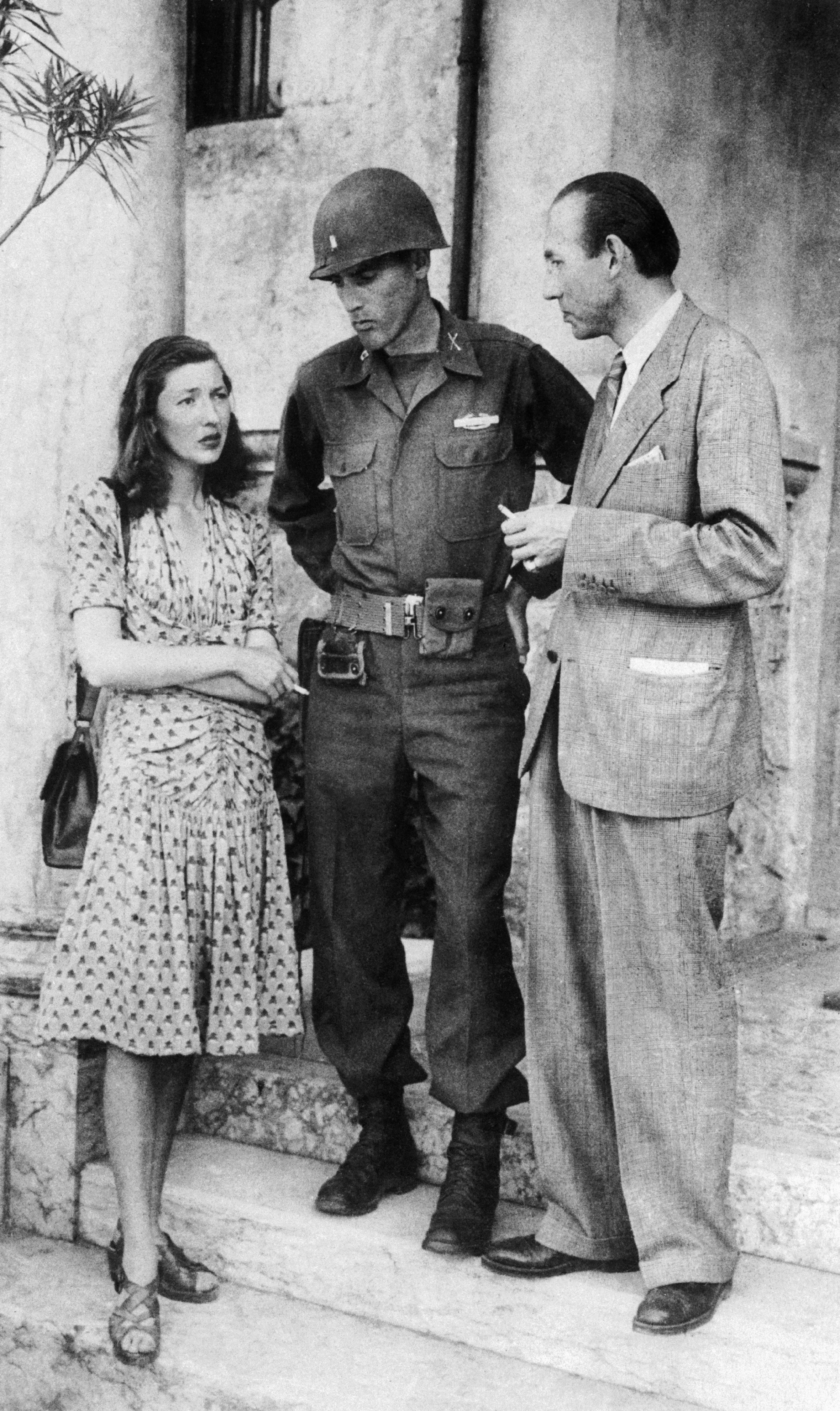 Corinne and her father Jean Luchaire being arrested by a soldier.