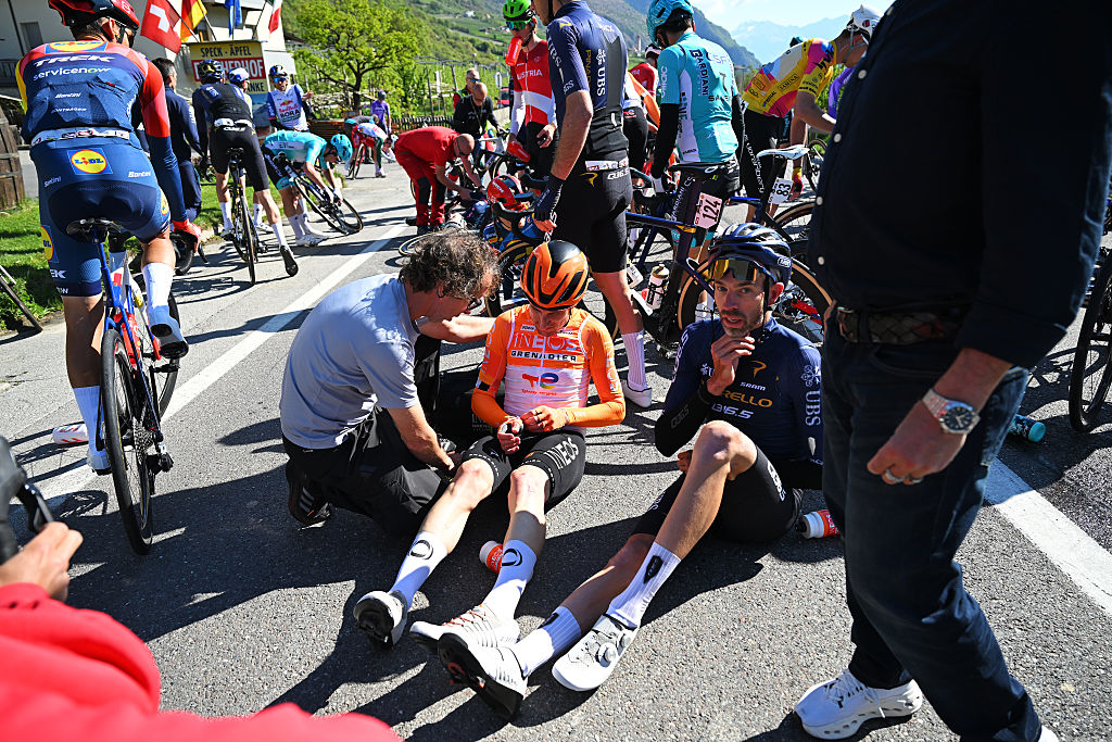LACES, ITALY - APRIL 22: (L-R) Victor Langellotti of Monaco and Team INEOS Grenadiers and Damien Howson of Australia and Team Pinarello Q36.5 Pro Cycling react after a crash during the 48th Tour of the Alps 2026, Stage 3 a 174.5km stage from Latsch - Laces to Arco on April 22, 2026 in Laces, Italy. (Photo by Tim de Waele/Getty Images)