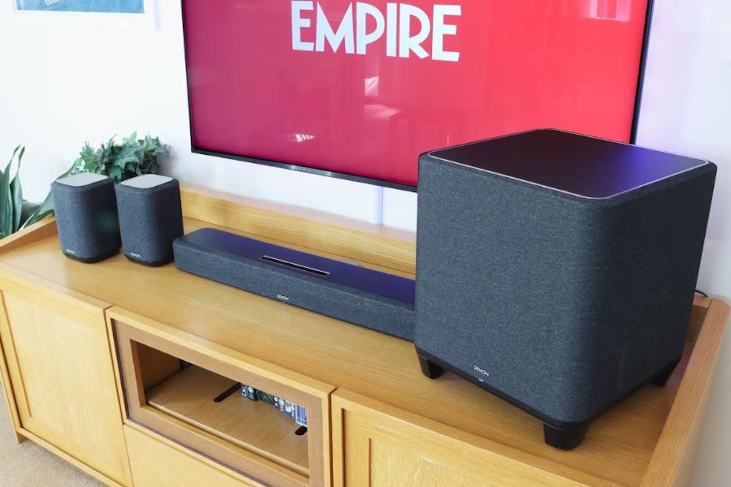Denon Home Cinema Kit on a unit with a TV and empire logo - - Best surround sound system for living room