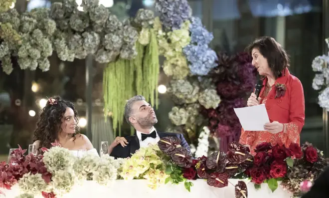 Joel's mum pictured doing a speech at the reception.
